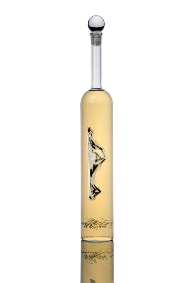 Glass bottle with a wolf design on a reflective surface