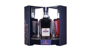 Alpsion liquor bottle in a decorative box on a gray background