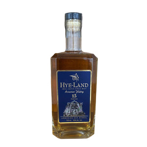 Bottle of Hye-Land Armenian Oak Barrel Whiskey on a wooden surface with a wooden background