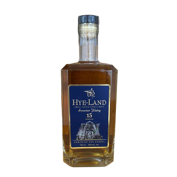 Bottle of Hye-Land Armenian Oak Barrel Whiskey on a wooden surface with a wooden background